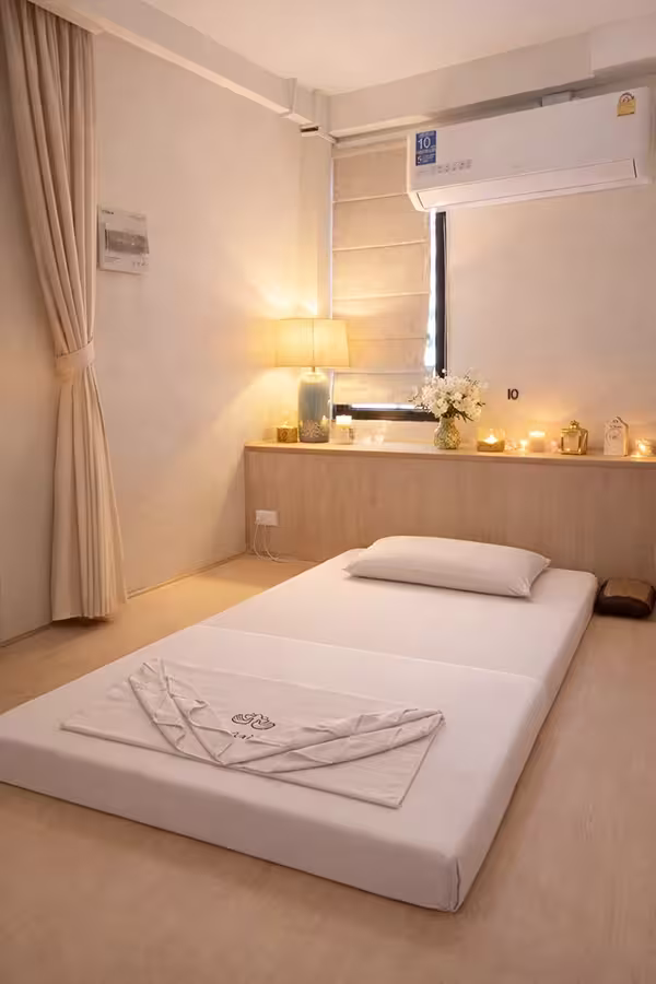 Private treatment bed in a massage room
